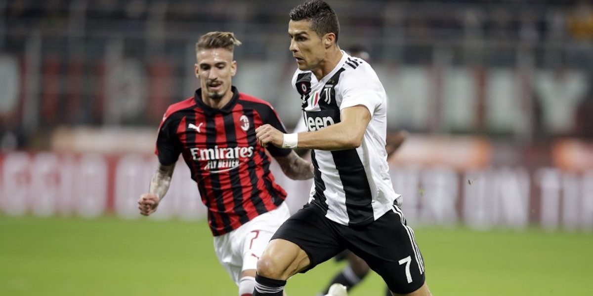 FILE - In this Sunday, Nov. 11, 2018 file photo, AC Milan's Samuel Castillejo, left, looks at Juventus' Cristiano Ronaldo running with the ball, during a Serie A soccer match between AC Milan and Juventus, at Milan's San Siro stadium, Italy. Serie A has announced details of the Italian Super Cup to be played in Saudi Arabia next month despite calls for the game to be moved after the killing of Washington Post columnist Jamal Khashoggi. The match between Juventus and AC Milan is slated to be played Jan. 16 at the King Abdullah Sports City Stadium in Jeddah. (AP Photo/Luca Bruno, File )